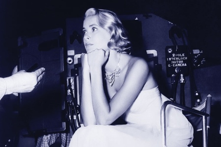 Grace Kelly seated on movie set