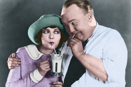 Man and woman sharing-milkshake