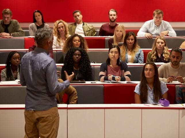 A lecturer speaks to university students, but what is the role of the lecture in modern HE?