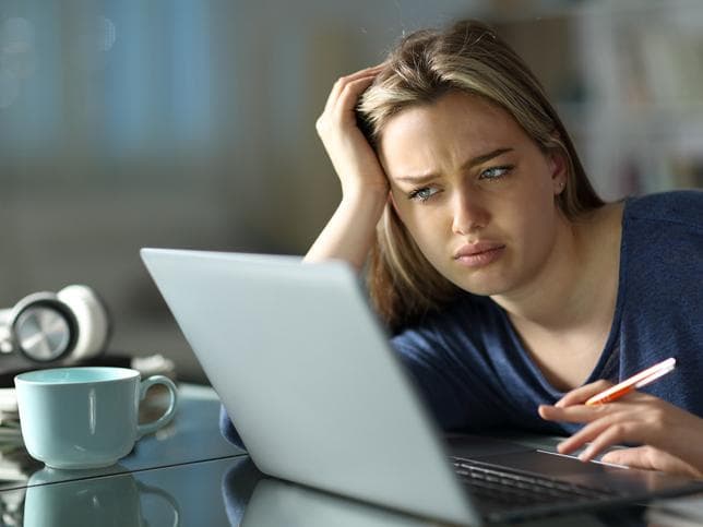 Female student frustrated with online learning