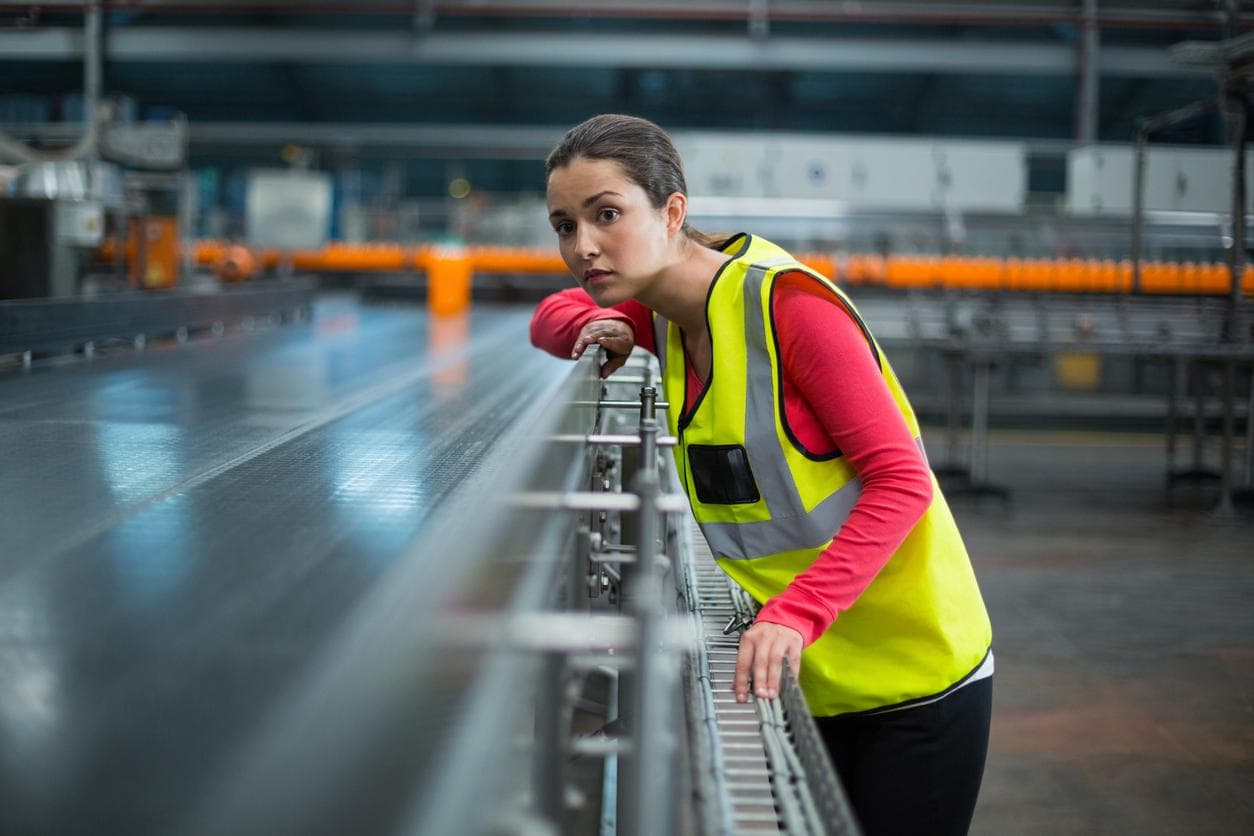 A female engineer overseeing a production line