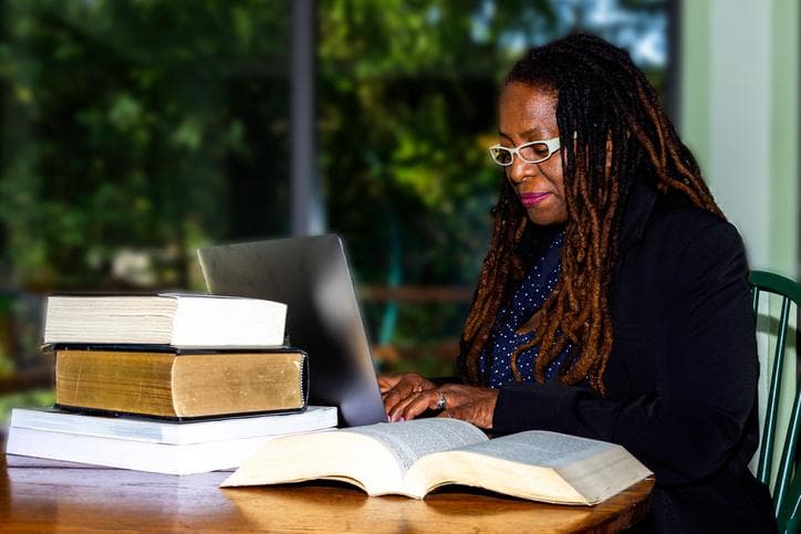 Black female academic at desk