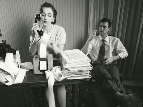 Vintage-style photo of secretary and co-worker