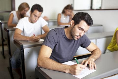 University students sitting a written in-person exam