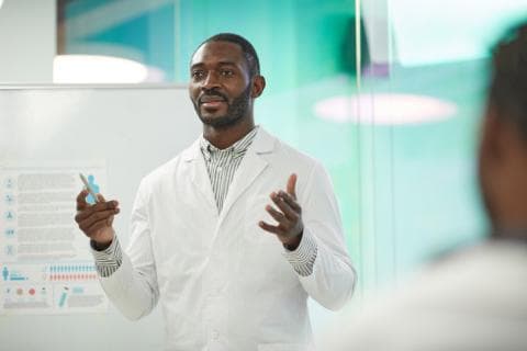 Black academic presenting at medical conference