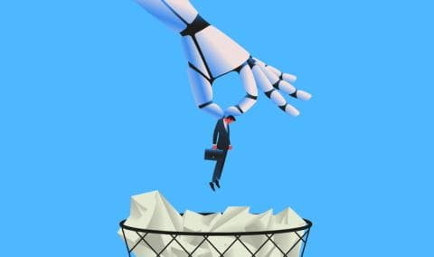 A robot hand dangles a businessman above a wastepaper bin