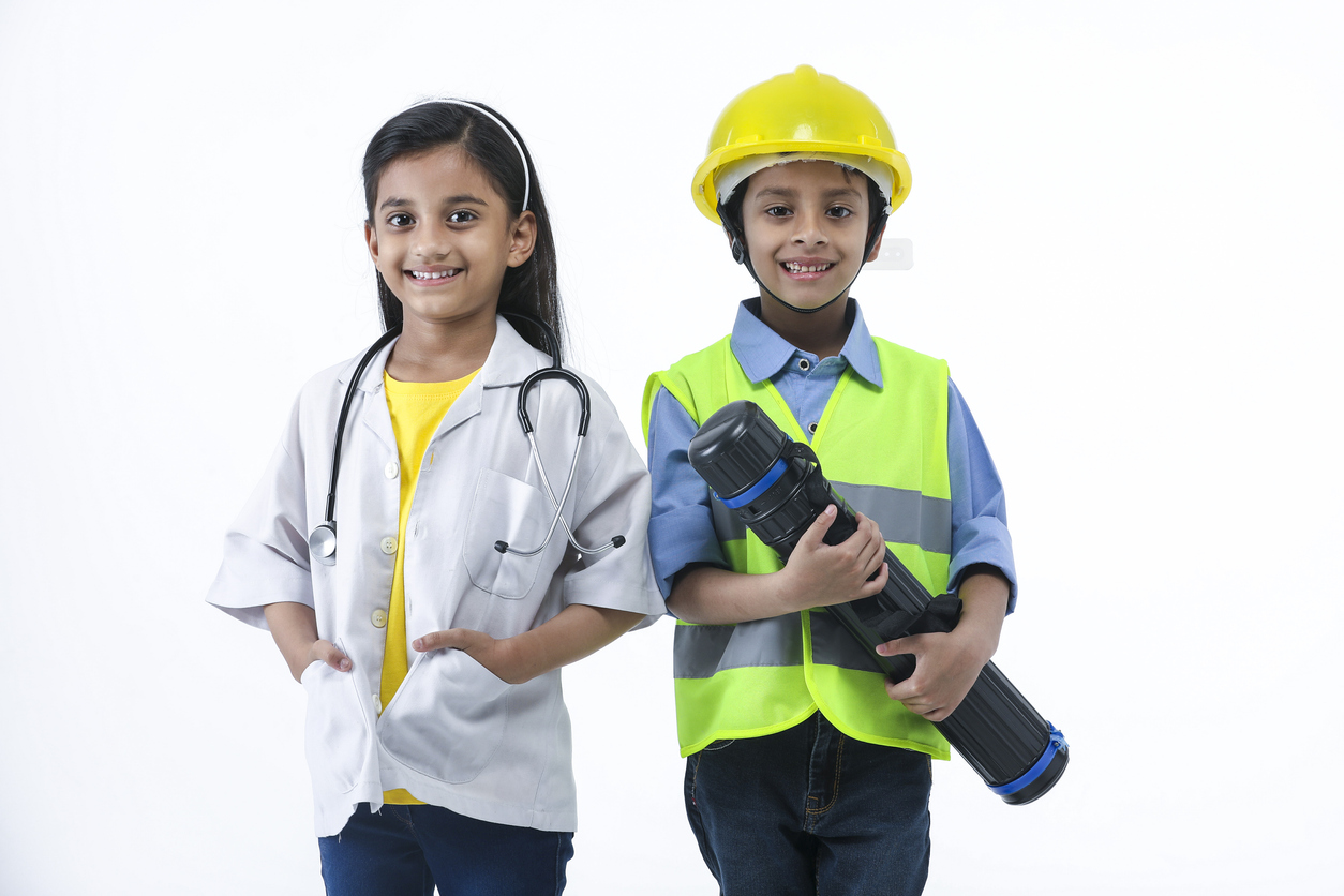 Two children, one dressed as a doctor, the other as an engineer