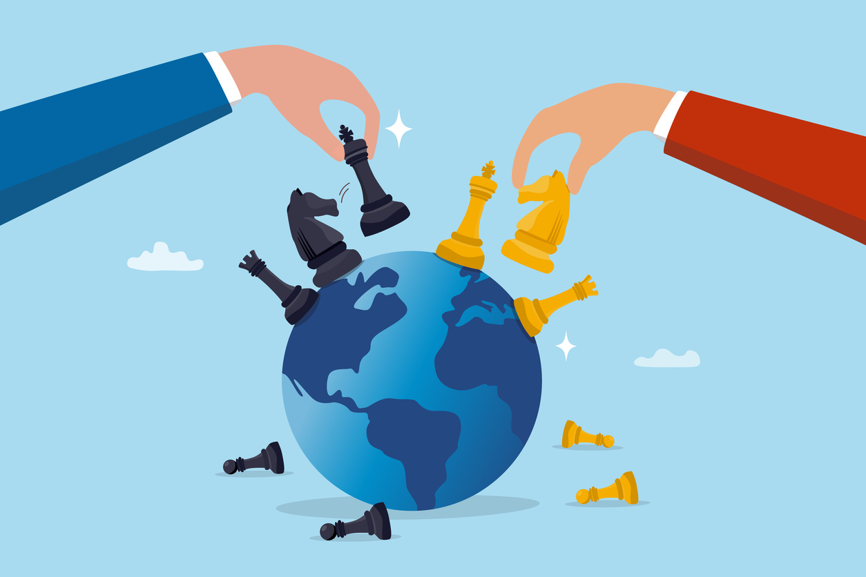 Two people playing chess on a globe