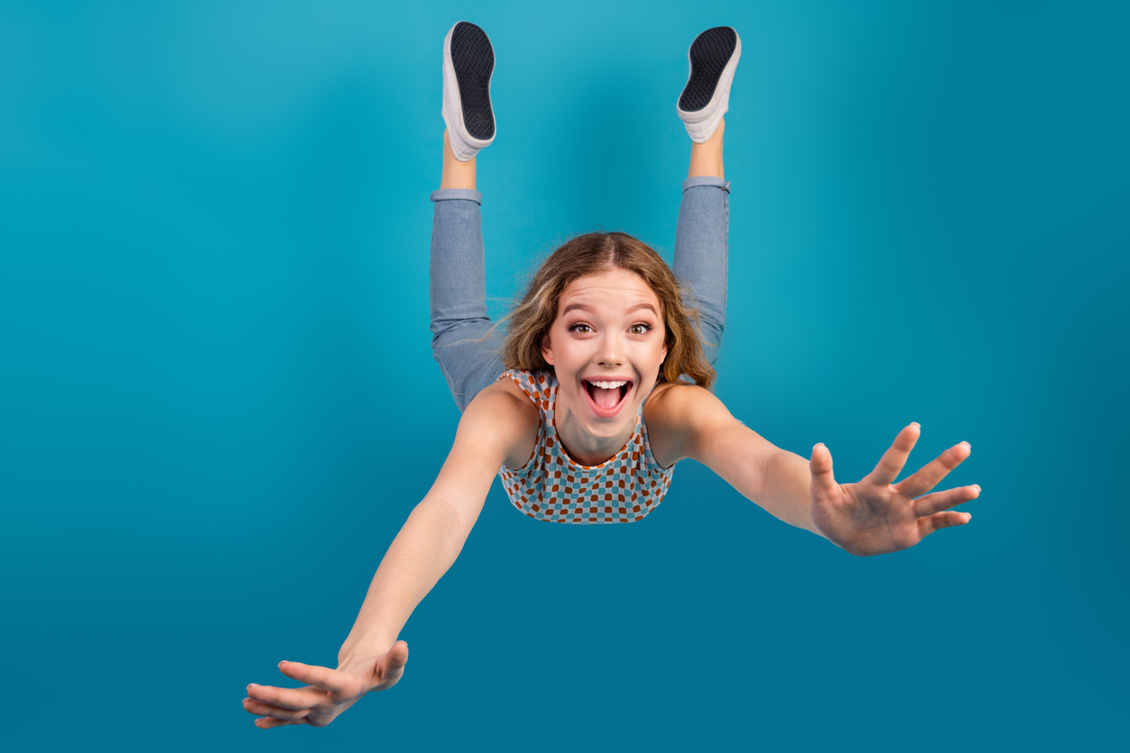 Smiling student falling through the air