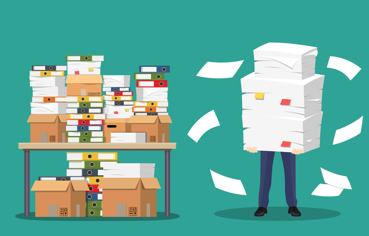 Drawing of person carrying enormous pile of paper, next to desk filled with files