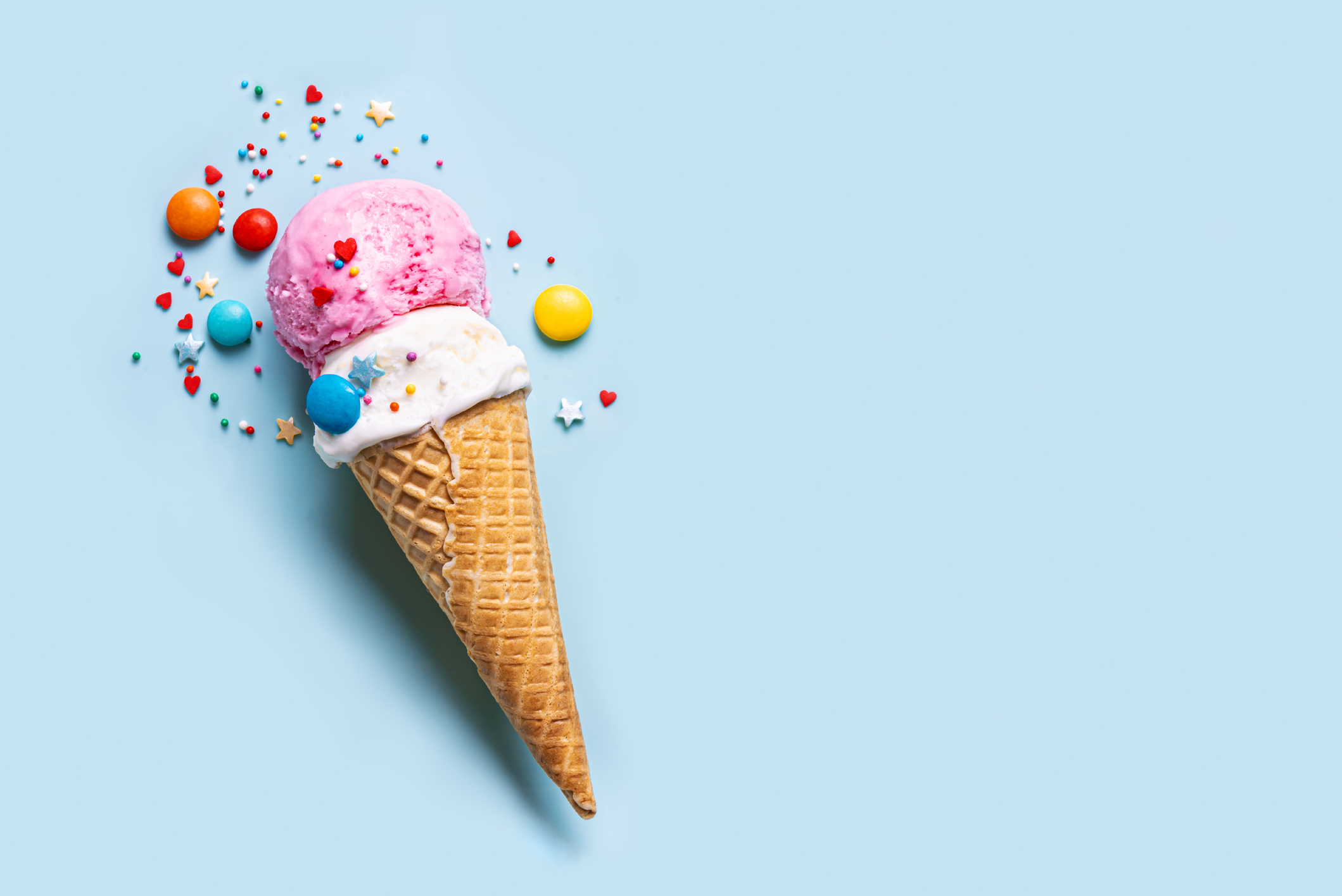 An ice-cream cone with two scoops, each a different flavour