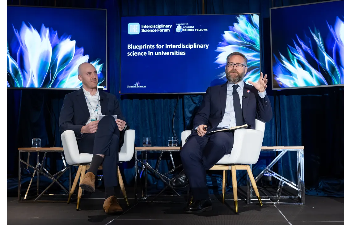 Two speakers on stage at the THE Interdisciplinary Science Forum, in association with Schmidt Science Fellows
