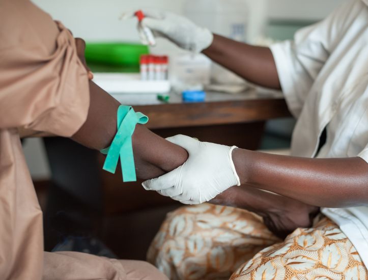 Nurse taking blood in Africa