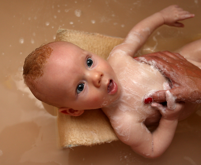 A baby being bathed