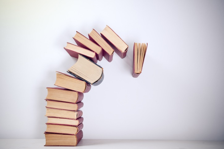Pile of books falling over