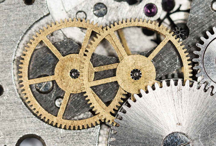 Two cogwheels driving a mechanism, symbolising innovation