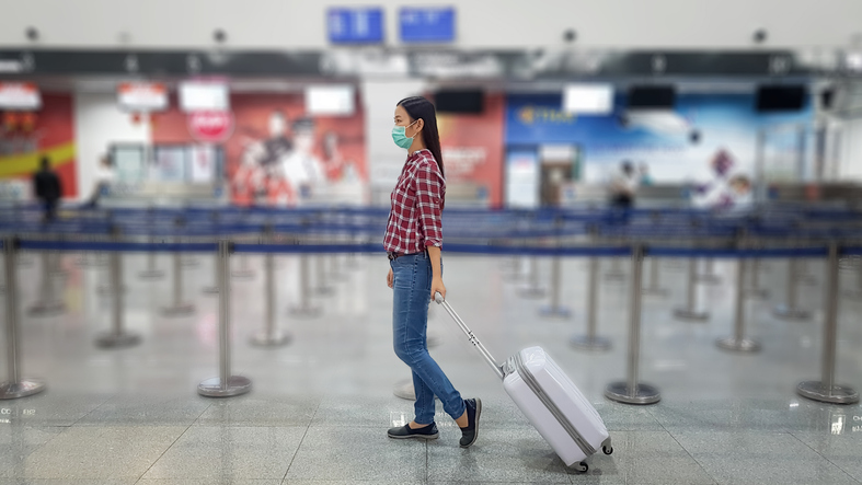 A Chinese tourist wears a surgical mask
