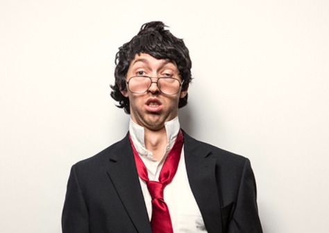 A dishevelled man in a suit