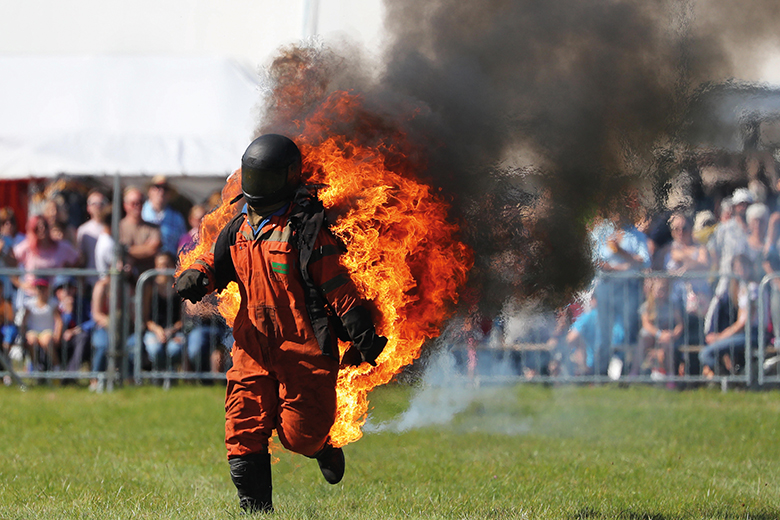 Man in hazard suit on fire