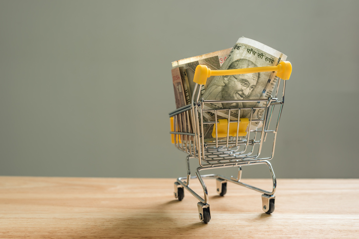 Indian banknotes in a small shopping trolley