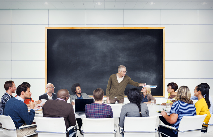 Students gathered around professor