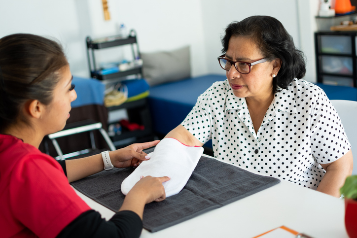 A hispanic woman at a medical appointment
