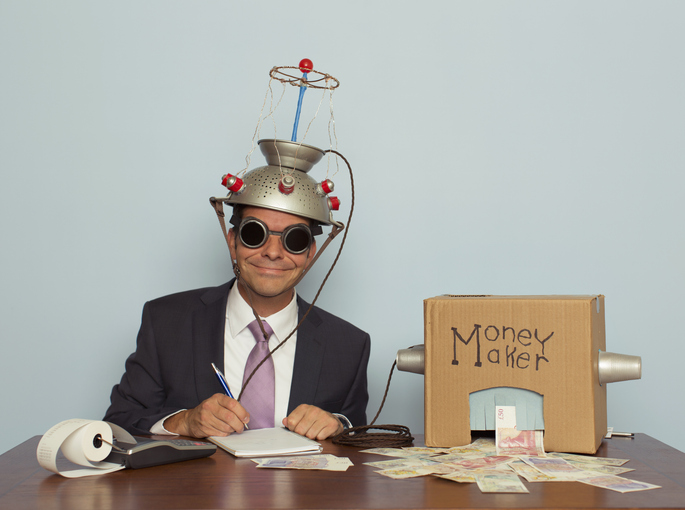 A suited figure with a money making machine, illustrating politician's focus on the commercial value of research