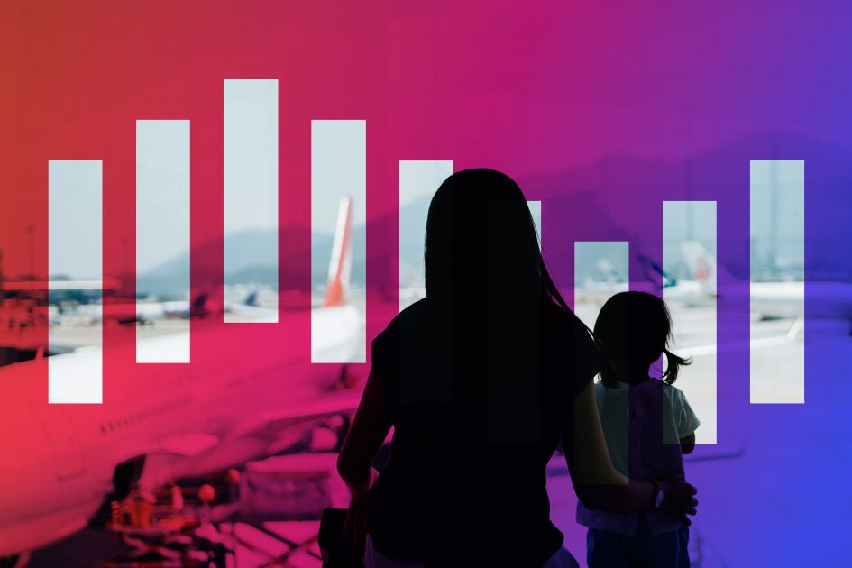 Mother and child watching as aeroplane departs