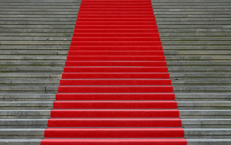 A red carpet up stairs