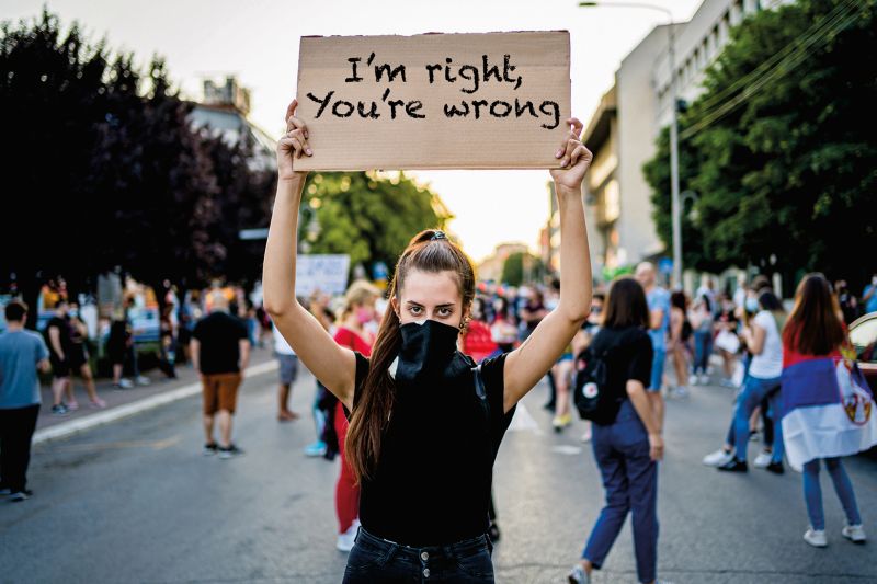 woman holding protest placard