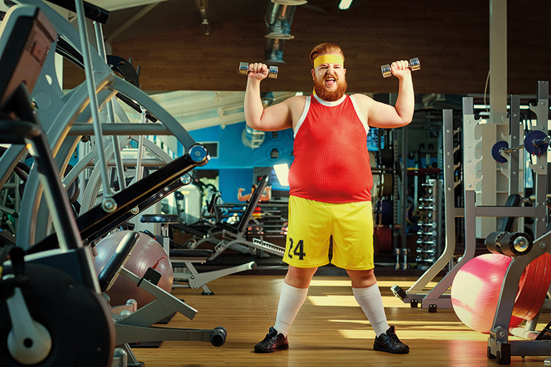 Man lifting weights in a gym