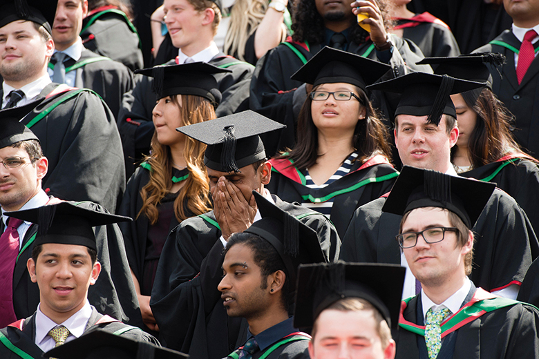 Graduating students in mortarboards