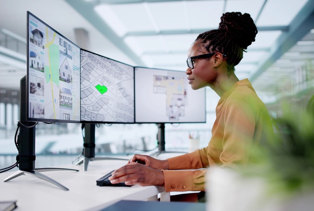 A town planner looks at her computer screen