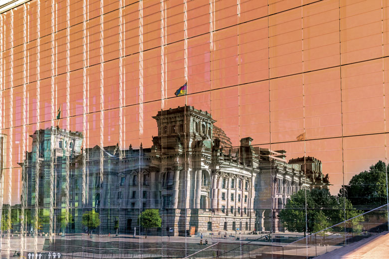 Reichstag building mirrored in glass as a metaphor to plagiarism scandals relating to politicians.