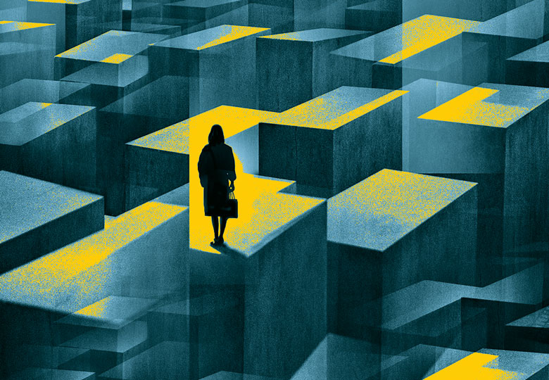 concept image of a woman standing in a maze of large confusing blocks.