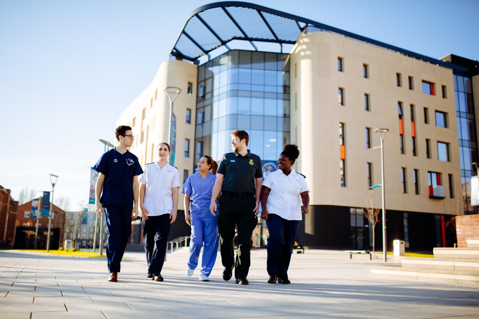 Faculty of Health Students Walking by Allam Medical Building