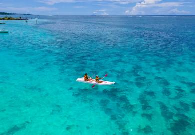 Canoers, on Mauritius beach