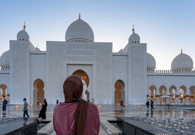 Woman in front of mosque in Abu Dhabi