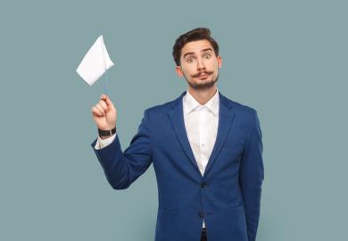 Man holding up white flag