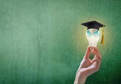 Lightbulb wearing a mortarboard and painted with an image of the world