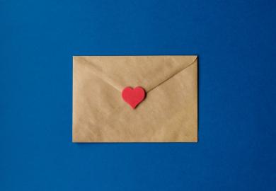 Brown envelope, sealed with a red love heart