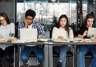 Four students, working on university applications