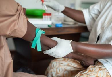 Nurse taking blood in Africa