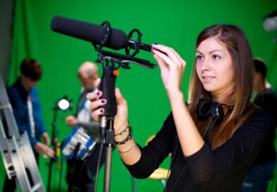 Apprentice journalist with microphone