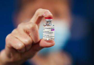 A healthcare worker holds a vial of AstraZeneca coronavirus disease (COVID-19) vaccine at the Pentland Medical Practice  on 7 January 2021 in Currie, Scotland.