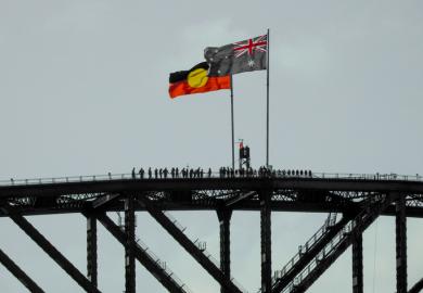 The Australian and Australian Aboriginal flags fly on the Sydney Harbour Bridge