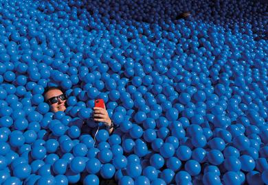 Person taking a selfie in a ball pit