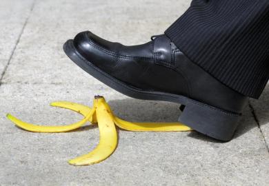 A suited man about to step on a banana peel, illustrating the threat to UK diplomacy posed by language department closures