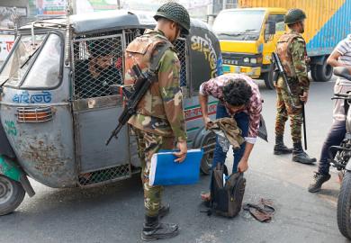 A police inspection in Dhaka, illustrating quality control