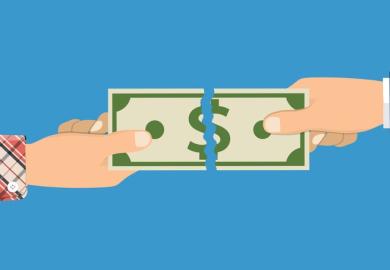 A dollar bill being torn